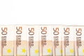 Aligned banknotes 50 euro european money on white background