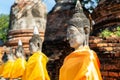 Aligned Buddha statues at Wat Yai Chai Mongkol (or Mongkhon), Ayutthaya, Thailand Royalty Free Stock Photo