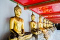 Aligned golden buddha statues Wat Pho temple bangkok Thailand