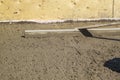 alignment of fresh concrete slab with special working tool Royalty Free Stock Photo