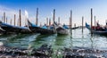 Alignment of gondolas in the lagoon near Saint Mark`s Square in Venice, Veneto, Italy Royalty Free Stock Photo