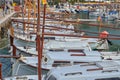 Alignment Of Traditional Majorcan Wooden Boats During a Sunny Day Along The Coastline