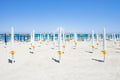 Alimini Grande, Apulia - Folded sunshades at the beautiful beach Royalty Free Stock Photo