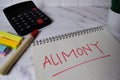 Alimony write on a book and keyword isolated on Office Desk Royalty Free Stock Photo