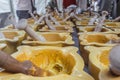 Alioli sauce being prepared in small yellow bowls