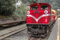 Alishan,taiwan-October 15,2018:The old red Train in Alishan Line come back to Chiyi train station at foggy day