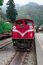 Alishan,taiwan-October 15,2018:The old red Train in Alishan Line come back to Chiyi train station at foggy day