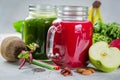 Alkaline diet concept - green and purple smoothies and ingredients Royalty Free Stock Photo