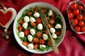 Alkaline diet concept with rocket mozzarella and fresh organic tomatoes