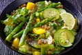 Alkaline green soup in black bowl, top view