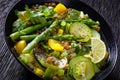 Alkaline green soup in black bowl, top view