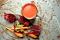 Alkaline, raw breakfast with red beet juice on a vintage table