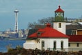 Alki Point Lighthouse by the sea with the background of the cityscape in Seattle, Washington, USA Royalty Free Stock Photo