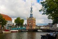 Alkmaar, Netherlands - August 08, 2022: Historic Excise Tower (Accijnstoren van Alkmaar) of 1622 and some houses