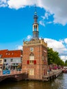 Alkmaar, Netherlands - August 08, 2022: Historic Excise Tower (Accijnstoren van Alkmaar) of 1622 and some houses