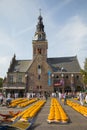 Alkmaar, Netherlands - July 20, 2018: View over the cheese market in Almaar in front of the old waag gebouw, weight building