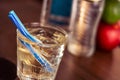 Alkohol drink with blue straw on the table Royalty Free Stock Photo