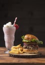 All-American Cheeseburger and Strawberry Shake Royalty Free Stock Photo