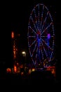 All American:Red, White and Blue July 4th Ferris Wheel in Carnival at Night Royalty Free Stock Photo