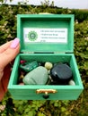 All Colour Colors Gemstone Polished Hand Palmstones Rocks in wooden Box Near Water Spiritual Royalty Free Stock Photo