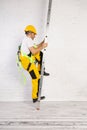 Irresponsible use of a ladder during construction work. Royalty Free Stock Photo