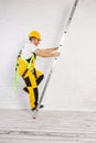 Irresponsible use of a ladder during construction work. Royalty Free Stock Photo