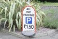 All day parking fee cost sign at car park entrance