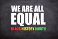 We are all equal and Black history month text in black board background. Royalty Free Stock Photo