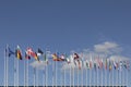 All EU Flags European Union flag waving in front of European Parliament, headquarter of the European Commission European