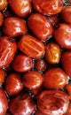 Photograph of Tasty red jojobas dipped in jojoba oil.this photo was taken on 28 of september by a canon camera with focusing lens