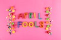 All fools day background concept with holiday accessories, April 1st themed party attributes. Close up, copy space, top view, flat Royalty Free Stock Photo