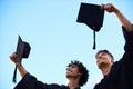 All the hard work paid off. students celebrating on graduation day. Royalty Free Stock Photo