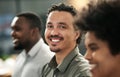 We all have our roles in the team. a handsome young businessman standing in the office with his coworkers. Royalty Free Stock Photo