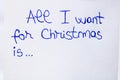 All I want for Christmas handwriting text close up isolated on white paper with copy space. Writing text on memo post reminder Royalty Free Stock Photo