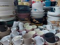 All kind of melamine and ceramic plates, dinner sets and cups bought to a local market to sell Royalty Free Stock Photo