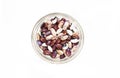 All kinds of kidney beans in a small glass bowl isolated on white background. Top view Royalty Free Stock Photo