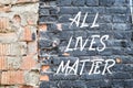 ALL LIVES MATTER poster on black brick wall Royalty Free Stock Photo