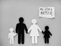 All lives matter, symbol of an interracial family cut out of black and white paper. no to racism. Mixed race family set