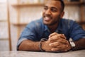 All my hard work paid off. a handsome young businessman leaning on the counter in his cafe with his hands clasped. Royalty Free Stock Photo