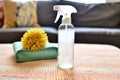 an all-natural rug cleaner spray bottle on a carpet