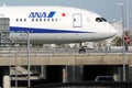 All Nippon Airways ANA plane taxiing over the bridge