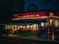 All in One Deli Mart sign at night in Brooklyn Heights, Brooklyn, New York