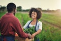 All our hard work paid off. a young farm couple carrying a crate of fresh produce. Royalty Free Stock Photo