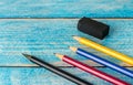 All pencil colorful sharpener on blurred wooden table