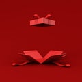 All red opening gift box blank opened present box with red ribbon bow on dark red background for christmas valentines and