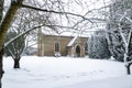 All Saints church in the small village of Sutton in the British countryside, it is totally covered in deep snow during a rare snow Royalty Free Stock Photo