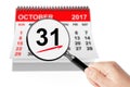 All Saints Day Concept. 31 October 2017 calendar with magnifier Royalty Free Stock Photo