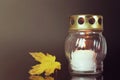 All Saints Day. White candle and autumn leaf Royalty Free Stock Photo