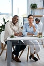 All set towards great achievements. Portrait of two businesspeople working together in an office. Royalty Free Stock Photo