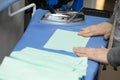 All sewn items and protective masks are pressed before being delivered to the customer Royalty Free Stock Photo